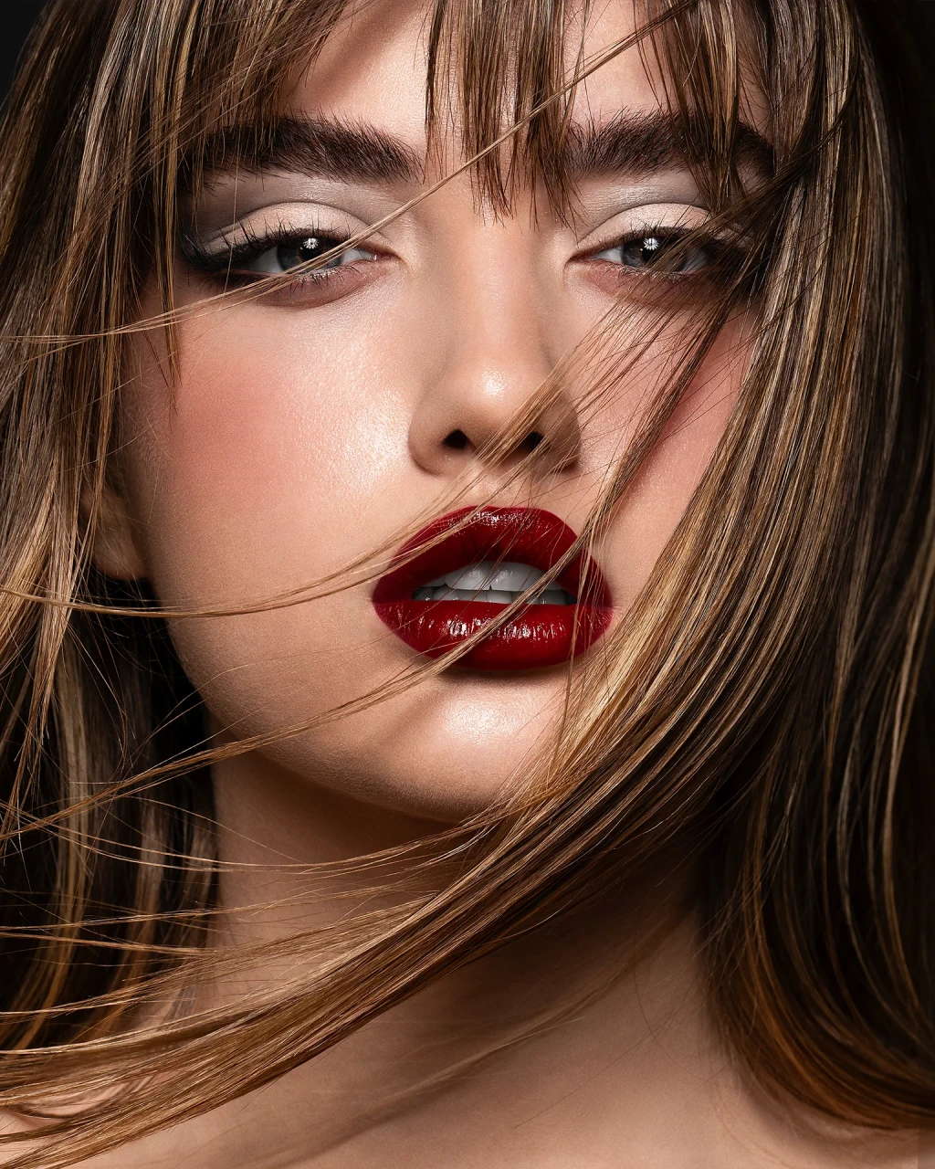 Final retouched beauty portrait: advanced dodge and burn for detail definition, preserved natural skin texture, and intense glossy red lips