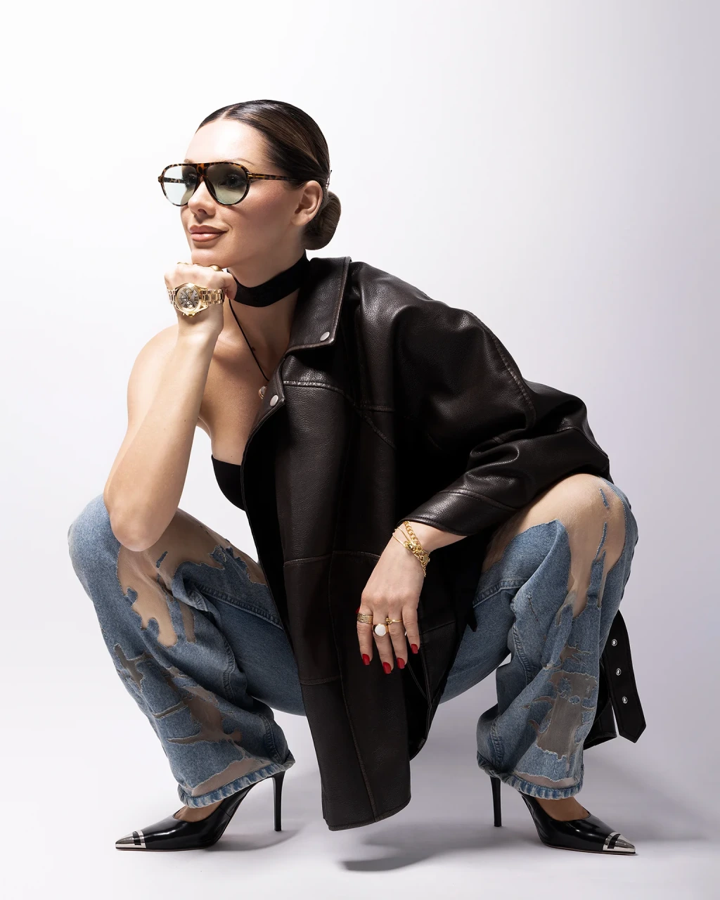 Full-length fashion portrait retouching of a female model in leather jacket and sunglasses, featuring color grading, clothing refinement, and preserved skin texture, photography by Inga Cebotari